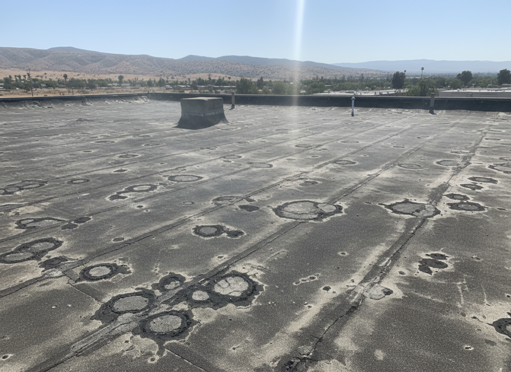 extreme sun beating down on commercial roof in Hemet showing heat damage
